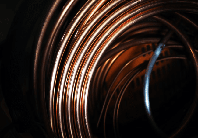 A closeup picture of copper wire in dim lights